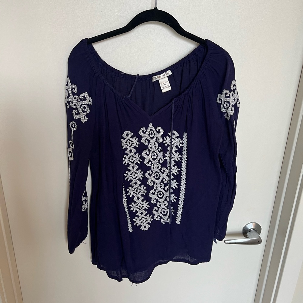 Blue blouse with white embroidery